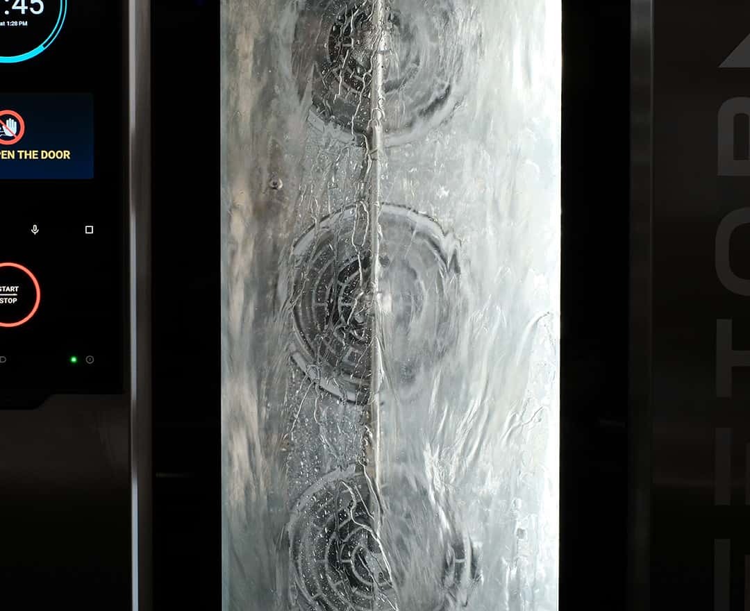 automatic washing cycle in progress inside a unox commercial combi oven