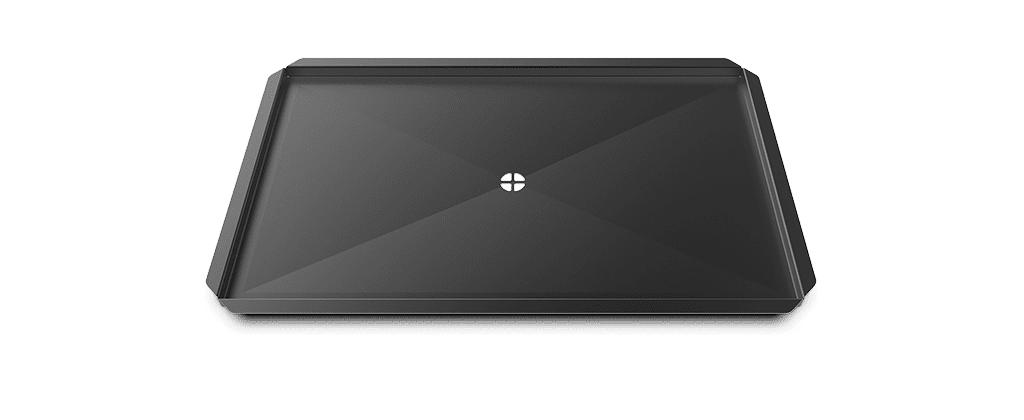 Bandeja profesional antiadherente con agujero central para conducir los líquidos y grasas hacia el drenaje del horno profesional XUC046.