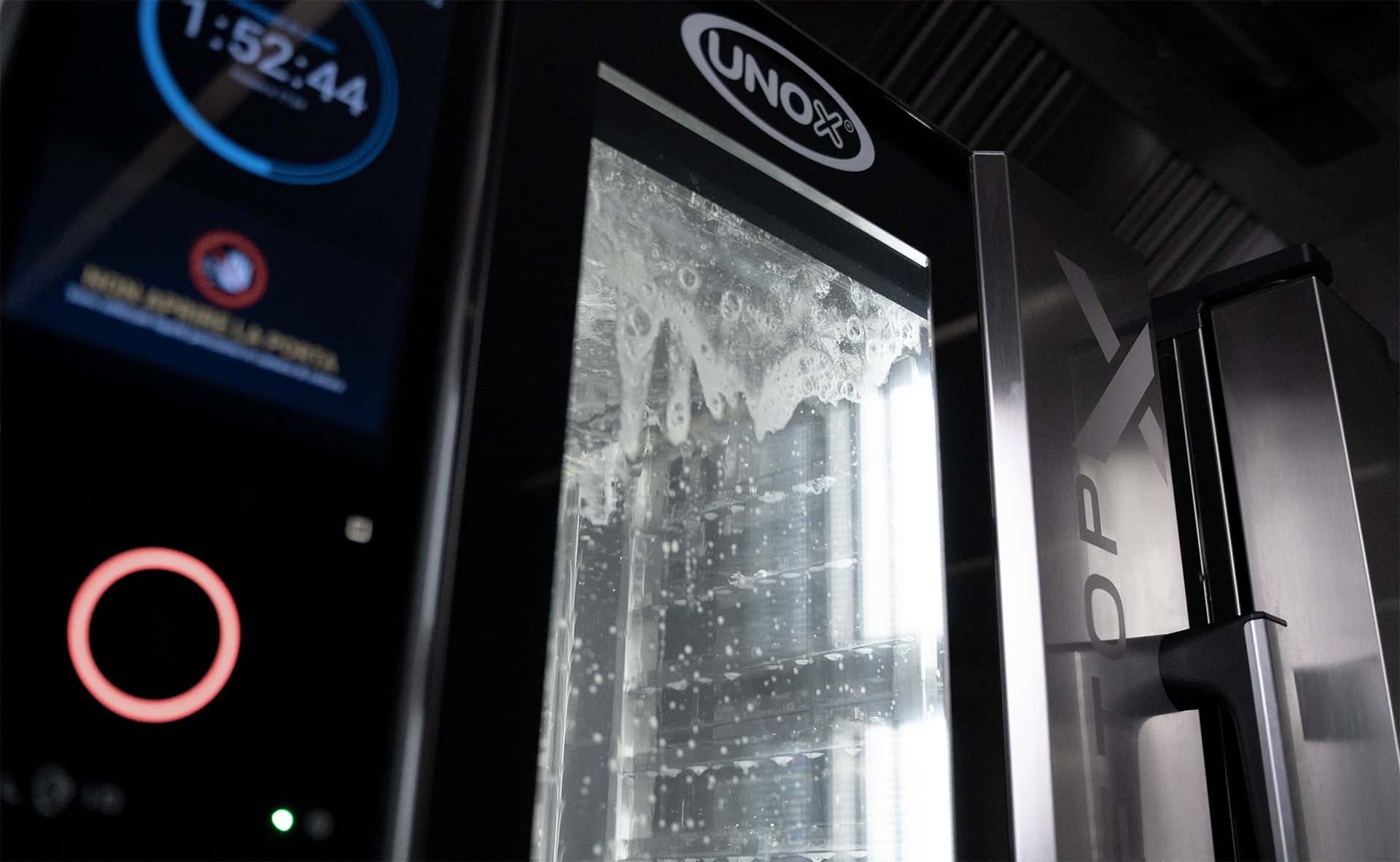 unox commercial oven during automatic washing cycle