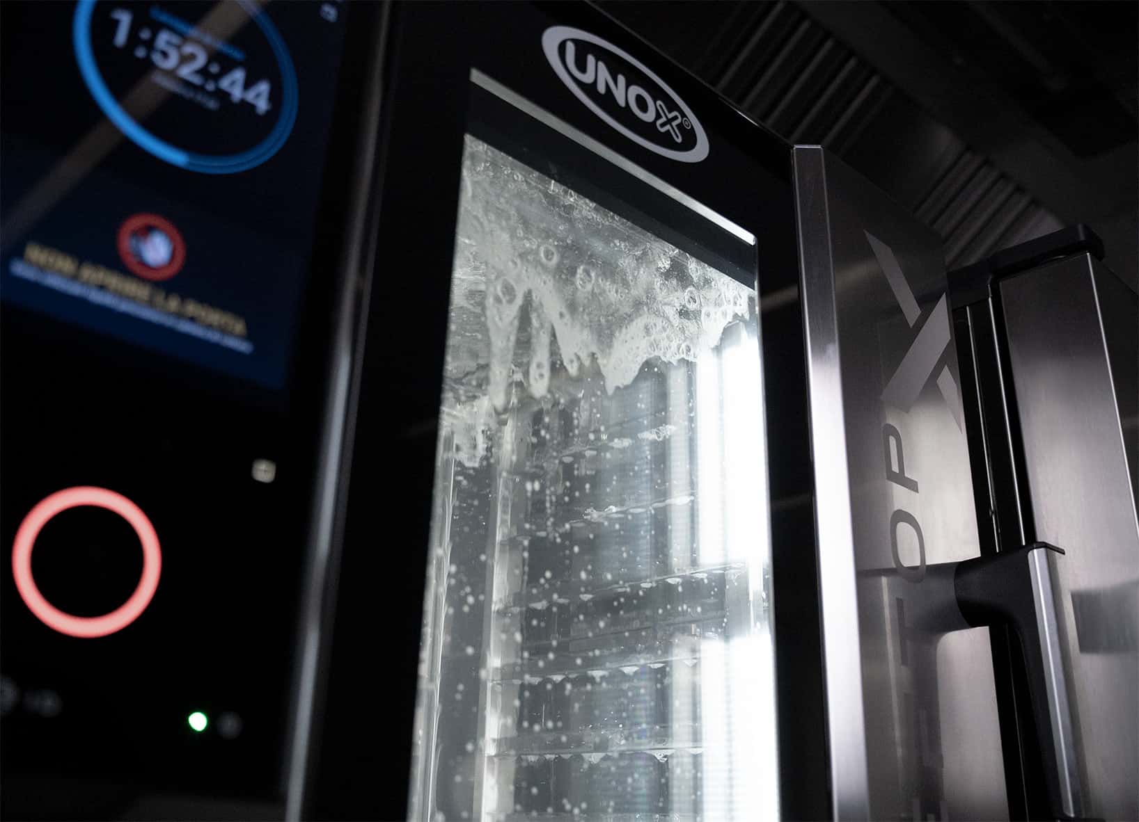 unox commercial oven during automatic washing cycle