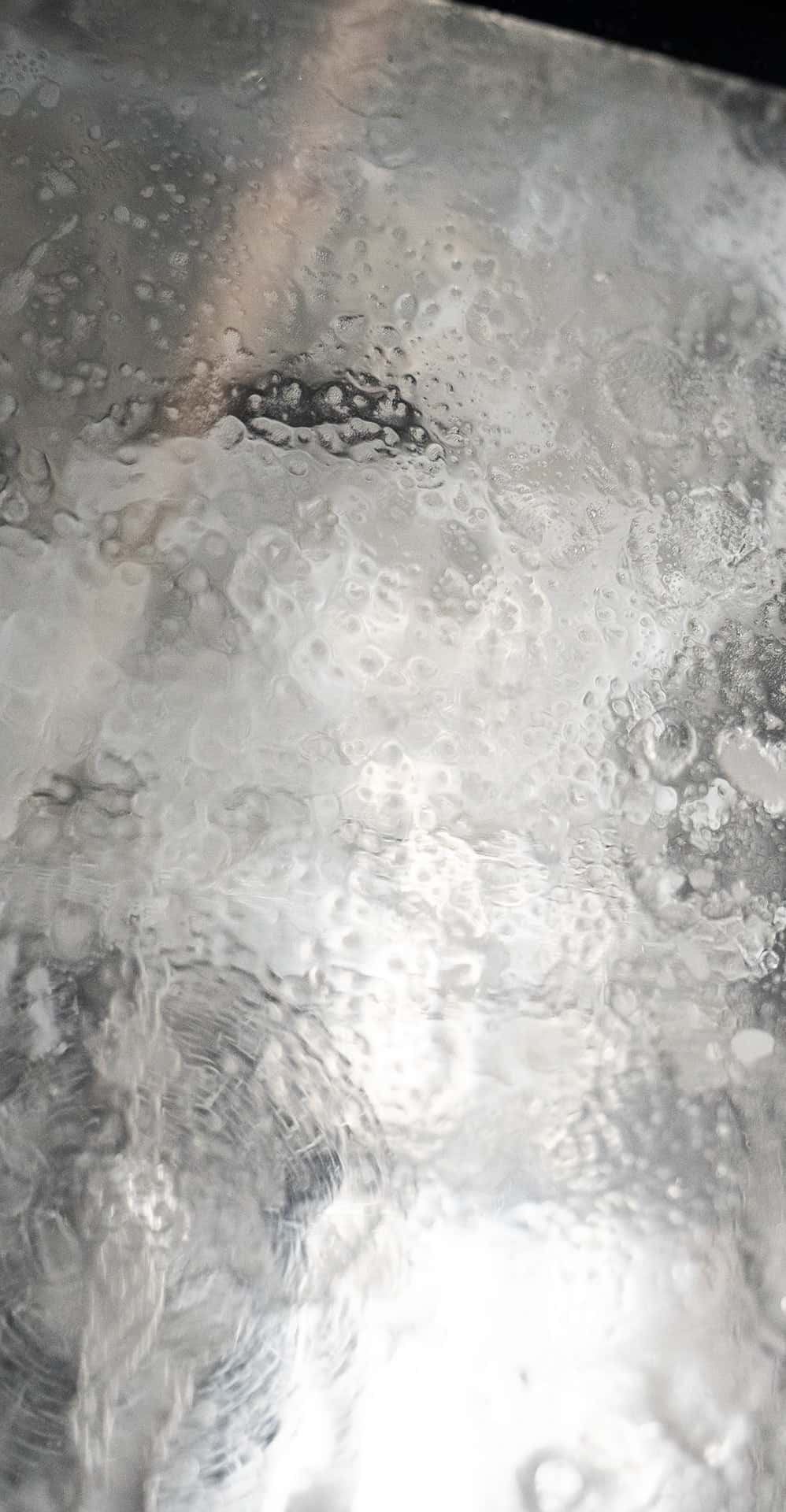 glass door of a unox commercial oven covered with detergent foam