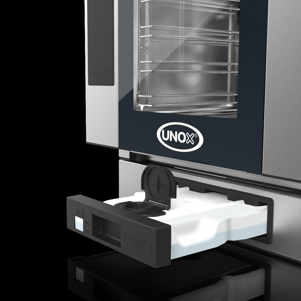 Image showing the cartridge slot on an unox oven, a cartridge half-way out of the slot.